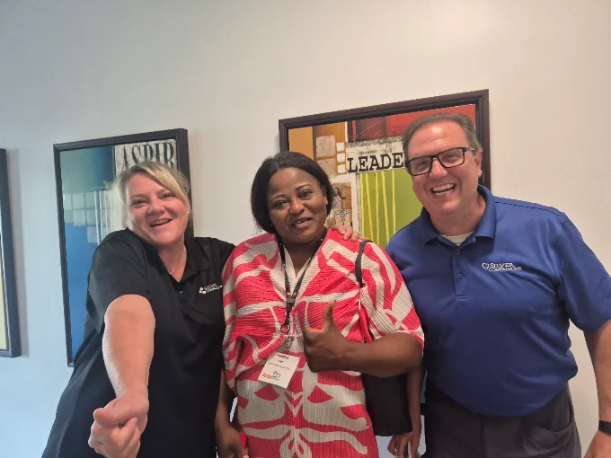 Elizabeth Ntopi with industry partners at a caregiving leadership event