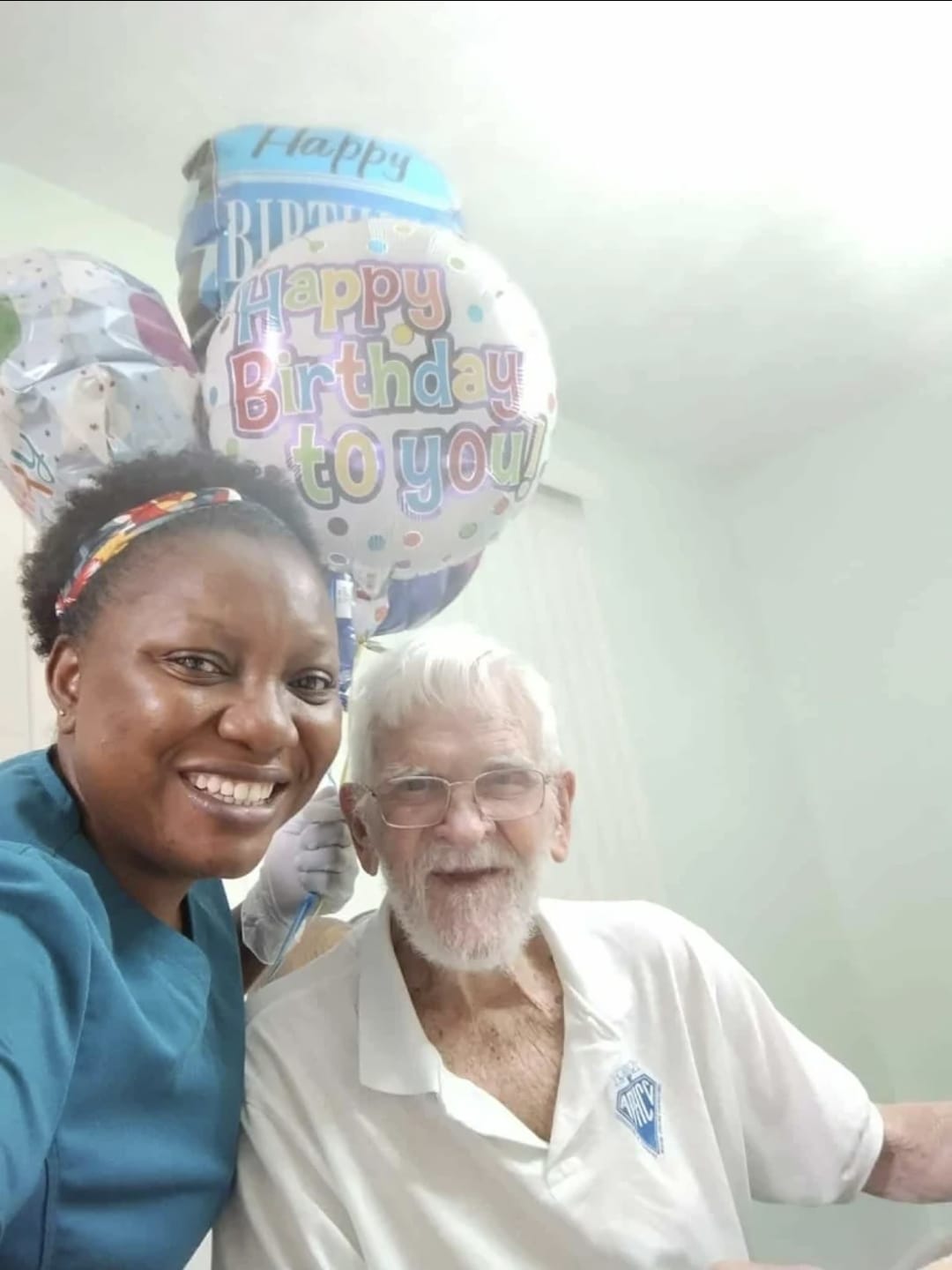 Mr. Jonny celebrating his 96th birthday with his Beteli Care caregiver and balloons